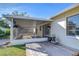 Spacious screened porch with wood deck and backyard access at 4804 Foxshire Cir, Tampa, FL 33624