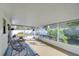 Spacious screened-in porch overlooking backyard at 4804 Foxshire Cir, Tampa, FL 33624