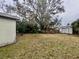 Backyard view featuring a large tree and shed at 4865 163Rd N Ave, Clearwater, FL 33762