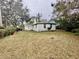 Large backyard with a shed and mature trees at 4865 163Rd N Ave, Clearwater, FL 33762