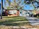 Brick ranch house with a driveway and a yard at 4865 163Rd N Ave, Clearwater, FL 33762