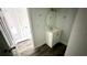 Simple bathroom with a vanity and round mirror at 502 E Cluster Ave, Tampa, FL 33604