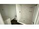 Small bathroom with a shower and hexagon tile at 502 E Cluster Ave, Tampa, FL 33604