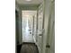 Long hallway with doors to other rooms at 502 E Cluster Ave, Tampa, FL 33604