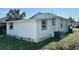 Side view of house showing exterior and landscaping at 502 E Cluster Ave, Tampa, FL 33604