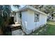 Back exterior with door and steps at 502 E Cluster Ave, Tampa, FL 33604