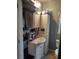 Clean bathroom with a white vanity, shower, and ample storage at 5266 6Th S Ave, St Petersburg, FL 33707