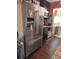 Kitchen with stainless steel French door refrigerator and hardwood floors at 5266 6Th S Ave, St Petersburg, FL 33707