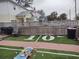 Artificial turf backyard with painted football field markings at 5266 6Th S Ave, St Petersburg, FL 33707