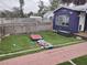 Side yard with artificial turf and a walkway at 5266 6Th S Ave, St Petersburg, FL 33707