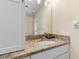 Bathroom with granite countertop, sink, and mirrored medicine cabinet at 5507 Darlene St, Spring Hill, FL 34607