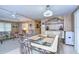 Bright dining area features a glass-topped table and charming metal chairs at 6125 Alpine Dr, Zephyrhills, FL 33542