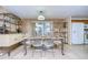 Bright dining room with a glass-top table and shelving at 6125 Alpine Dr, Zephyrhills, FL 33542