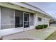 Screened patio area with table and chairs at 6125 Alpine Dr, Zephyrhills, FL 33542