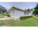 Side view of a single story home showcasing a garage at 6125 Alpine Dr, Zephyrhills, FL 33542