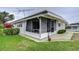 Screened porch and a portion of the house at 6125 Alpine Dr, Zephyrhills, FL 33542