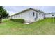 Another side view of the house showing the backyard at 6125 Alpine Dr, Zephyrhills, FL 33542