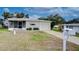 Landscaped front yard of a single story home at 6125 Alpine Dr, Zephyrhills, FL 33542