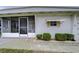 White single story home with carport and screened porch at 6125 Alpine Dr, Zephyrhills, FL 33542