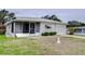 White single story home with attached garage at 6125 Alpine Dr, Zephyrhills, FL 33542