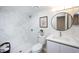 Updated bathroom with marble shower and modern vanity at 6411 Monterey Blvd, Tampa, FL 33625