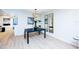 Modern dining room with dark table and light wood floors at 6411 Monterey Blvd, Tampa, FL 33625