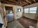 A rundown kitchen in need of renovation, showing the floor, walls and plumbing at 6502 S Himes Ave, Tampa, FL 33611