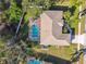 Single-Gathering home with a screened-in pool and fenced backyard at 714 Hidden Lake Dr, Tarpon Springs, FL 34689