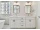 Elegant bathroom with double vanity and white cabinets at 714 Hidden Lake Dr, Tarpon Springs, FL 34689