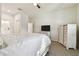 Bedroom with queen bed, dresser, and ensuite bathroom access at 714 Hidden Lake Dr, Tarpon Springs, FL 34689