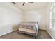 Bright bedroom with ceiling fan and window with shutters at 714 Hidden Lake Dr, Tarpon Springs, FL 34689