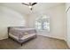 Spacious bedroom with ceiling fan and large window at 714 Hidden Lake Dr, Tarpon Springs, FL 34689