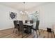 Spacious dining area with six chairs and a stylish chandelier at 714 Hidden Lake Dr, Tarpon Springs, FL 34689