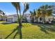 Single-story home with attached garage and lush landscaping at 714 Hidden Lake Dr, Tarpon Springs, FL 34689