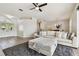 Living room with sectional sofa, ottoman, and pool view at 714 Hidden Lake Dr, Tarpon Springs, FL 34689