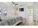 Main bedroom with king bed, TV, and access to bathroom and patio at 714 Hidden Lake Dr, Tarpon Springs, FL 34689