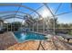 Inviting screened pool with a spacious patio area at 714 Hidden Lake Dr, Tarpon Springs, FL 34689