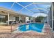 Beautiful screened pool with a large patio and fenced yard at 714 Hidden Lake Dr, Tarpon Springs, FL 34689