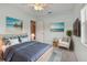 Cozy bedroom with beach decor and ceiling fan at 731 74Th N St, St Petersburg, FL 33710