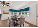 Dining room with large windows, a ceiling fan and decorative rug at 731 74Th N St, St Petersburg, FL 33710