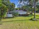 House exterior showcasing a well-maintained yard and lush landscaping at 731 74Th N St, St Petersburg, FL 33710