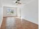 Bright living room with tile floors and ceiling fan at 731 74Th N St, St Petersburg, FL 33710