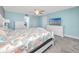 Spacious bedroom with ceiling fan and coastal bedding at 7540 Bay Island S Dr # 253, South Pasadena, FL 33707