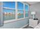 Bedroom with water view and white nightstand at 7540 Bay Island S Dr # 253, South Pasadena, FL 33707