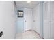 Clean hallway with tiled floors and extra storage at 7540 Bay Island S Dr # 253, South Pasadena, FL 33707