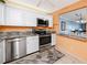 Modern kitchen with stainless steel appliances and granite countertops at 7540 Bay Island S Dr # 253, South Pasadena, FL 33707