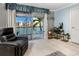 Living room with water view and access to balcony at 7540 Bay Island S Dr # 253, South Pasadena, FL 33707