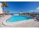 Community pool with lounge chairs at 7540 Bay Island S Dr # 253, South Pasadena, FL 33707