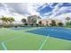 Two tennis courts with palm trees at 7540 Bay Island S Dr # 253, South Pasadena, FL 33707