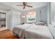 Comfortable bedroom featuring two beds, ceiling fan, and plenty of natural light at 801 83Rd N Ave # 215, St Petersburg, FL 33702